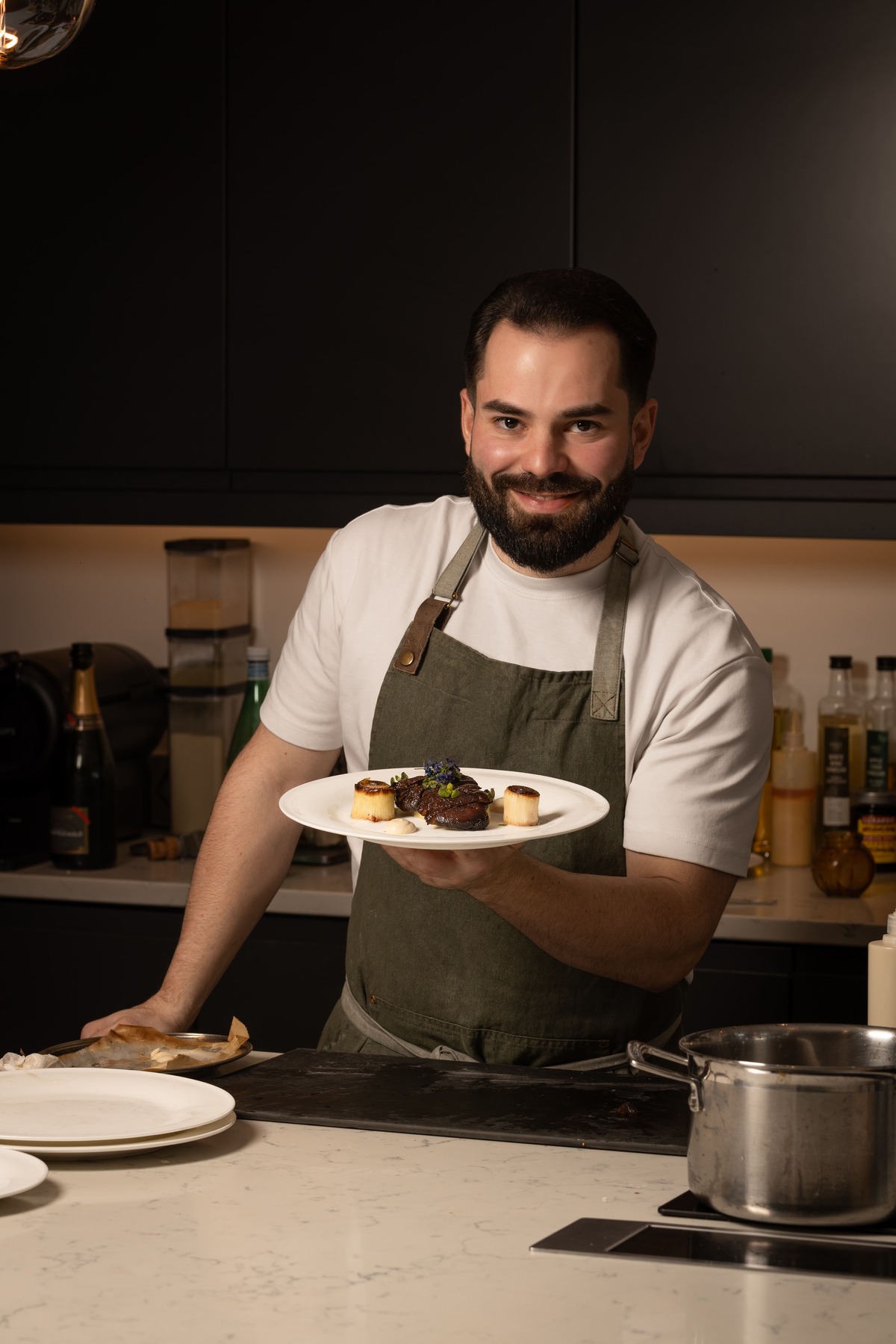 Chef Isi Morales holding plates