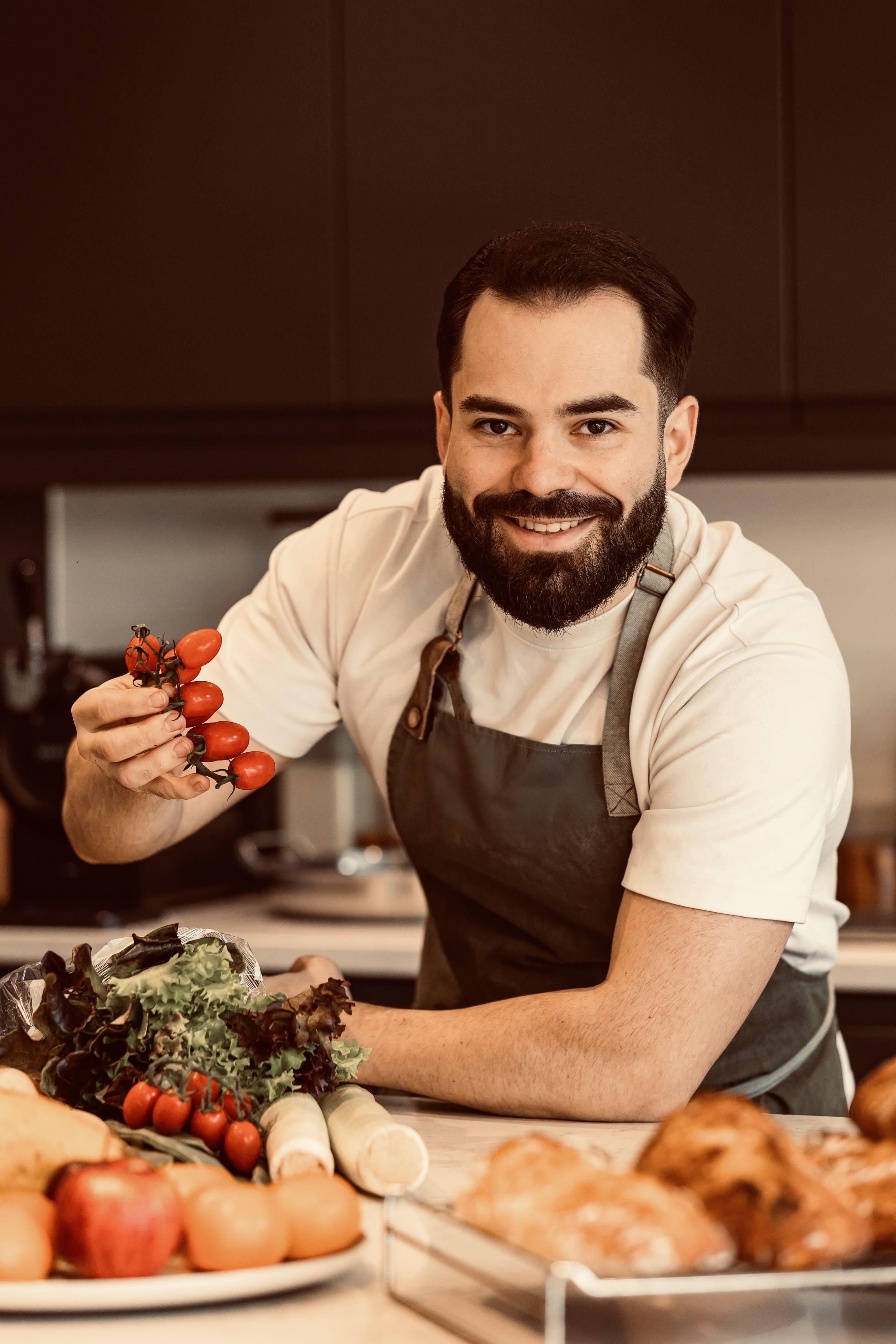 Chef Isi Morales with fresh tomatoes